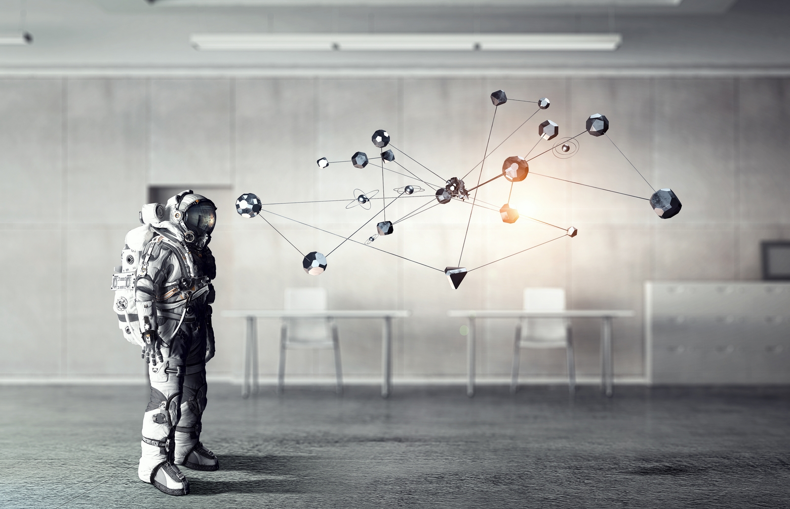 Astronaut looking at network of planets